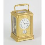 French carriage clock, 19th Century, the gorge case and face plate richly engraved with leaf and