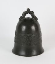 A Chinese bronze bell with mythological animal handle, decorated with a continual band of