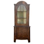 Walnut display/corner cabinet, 19th Century, the upper section with glazed door enclosing shelves,