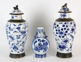 A Chinese blue and white Pilgrim Flask shaped vase, decorated with three seated scholars; the base
