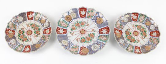 Three Japanese Daishoji Imari dishes , Meiji Period or later; each with moulded petal borders and