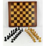 Boxwood and ebonised Staunton pattern chess set, folding games board with backgammon,
