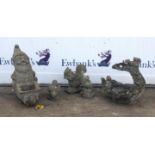 Group of reconstituted stone garden ornaments to include a gnome wheeling a barrow H43cm, an owl,