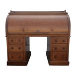 Victorian mahogany roll top desk, with a galleried top, above sliding lid, enclosing pigeon holes