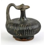 South Italian black-glazed juglet with ribbed body, 9 cm high Provenance: These items were