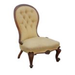Victorian mahogany spoon back nursing chair, with scrolling feet, upholstered with yellow ochre