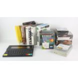 An assortment of PC games and accessories, an Avenger joystick and an Amstrad Notepad Computer