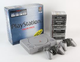 PlayStation 1 Value Pack boxed console with 14 games + original Demo1 disc Includes: Demo1,
