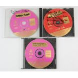 An assortment of 'Review/Preview Version' video game discs across multiple platforms These are
