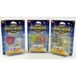 An assortment of Digimon Action Figures Includes: Gatomon, Gomamon and Tentomon