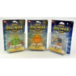 An assortment of 3 Digimon figures Includes: Togemon & Agumon Spinning Digi-Tops and Zudomon