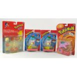 An assortment of 4 boxed Pokémon figures Includes: Movie 5-Pack, Pokémon Sliders (x2) and Nidorino