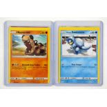 Pokemon TCG. Two miscut pokemon cards. These cards would have been miscut during the cutting