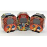 Pokemon TCG. Three empty official Pokemon Charizard tins.