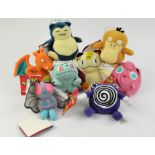 An assortment of 8 Pokémon Plush Beanies from 1998 Includes: Snorlax, Butterfree, Psyduck,