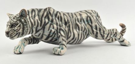 Keza Rudge (British, 1968), tiger, raku pottery, white with black stripes and hints of blue,