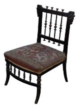 Aesthetic Movement, a black and painted japanned chair, with bobbin turned rails and gros-point