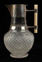 In the manner of Dr Christopher Dresser (1834-1904), Victorian silver and cut glass claret jug with