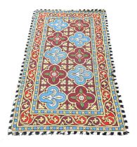 In the Style of Augustus Welby Pugin (British 1812-1852), a Gothic taste needlework carpet,