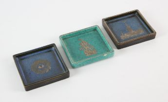 Gustavsberg Argenta, Sweden, three square trays, two in a blue colourways, one decorated with the