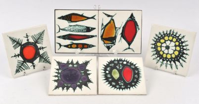 Kenneth Clark tiles, four tiles with abstract coloured designs, printed marks to backs, 15cm square,