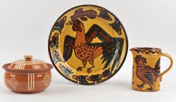 Mary Wondrausch (British, 1923-2016), a large slipware dish decorated with a cockerel to the front,