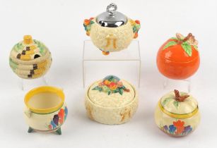 Clarice Cliff, Crocus pattern, a round preserve jar and cover, and a cauldron form sugar bowl,