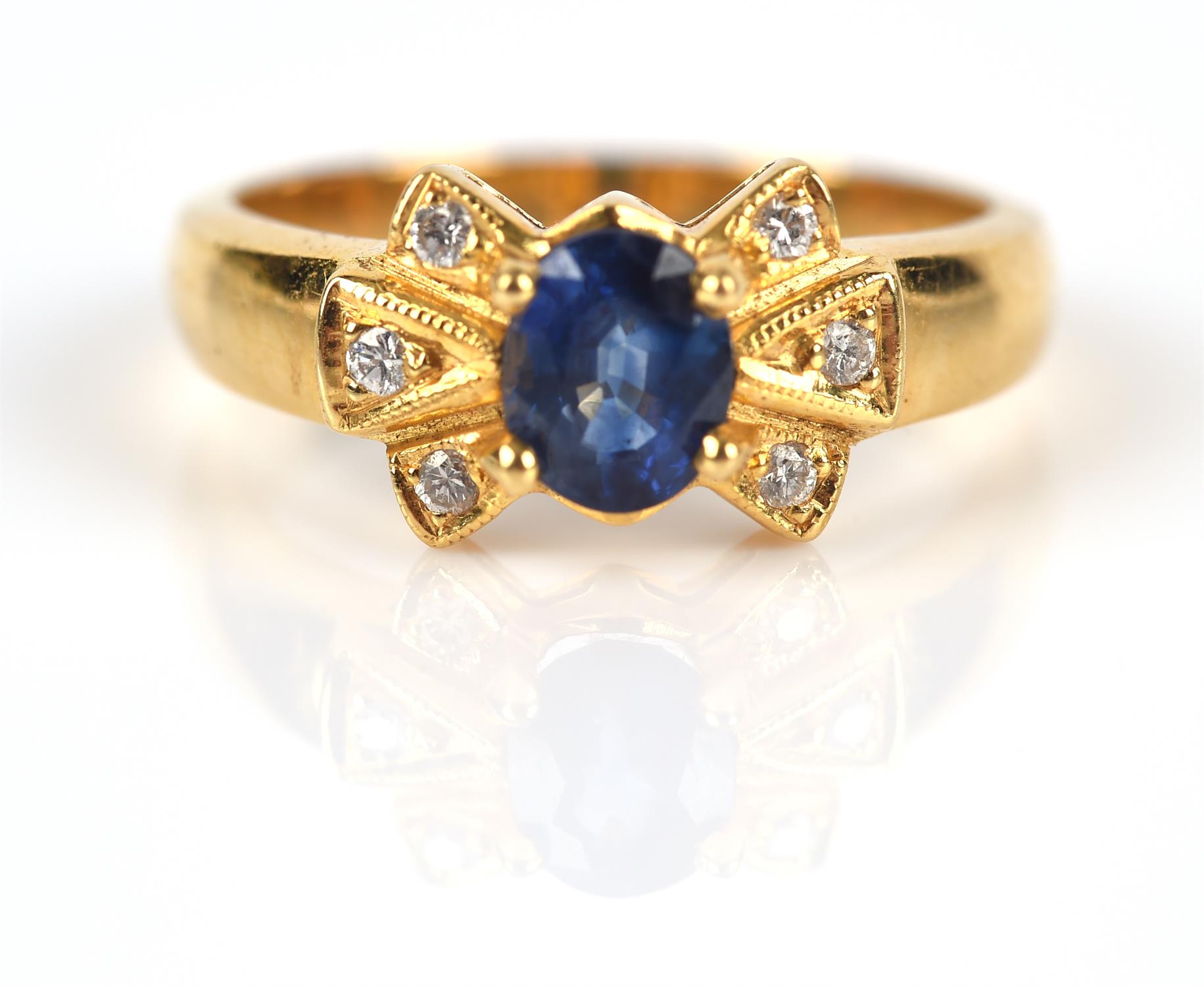 Modern sapphire and diamond ring, central claw set oval cut sapphire weighing an estimated 0.