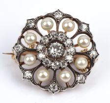 An antique pearl and diamond brooch, central old cut diamond surrounded by eleven old cut diamonds,