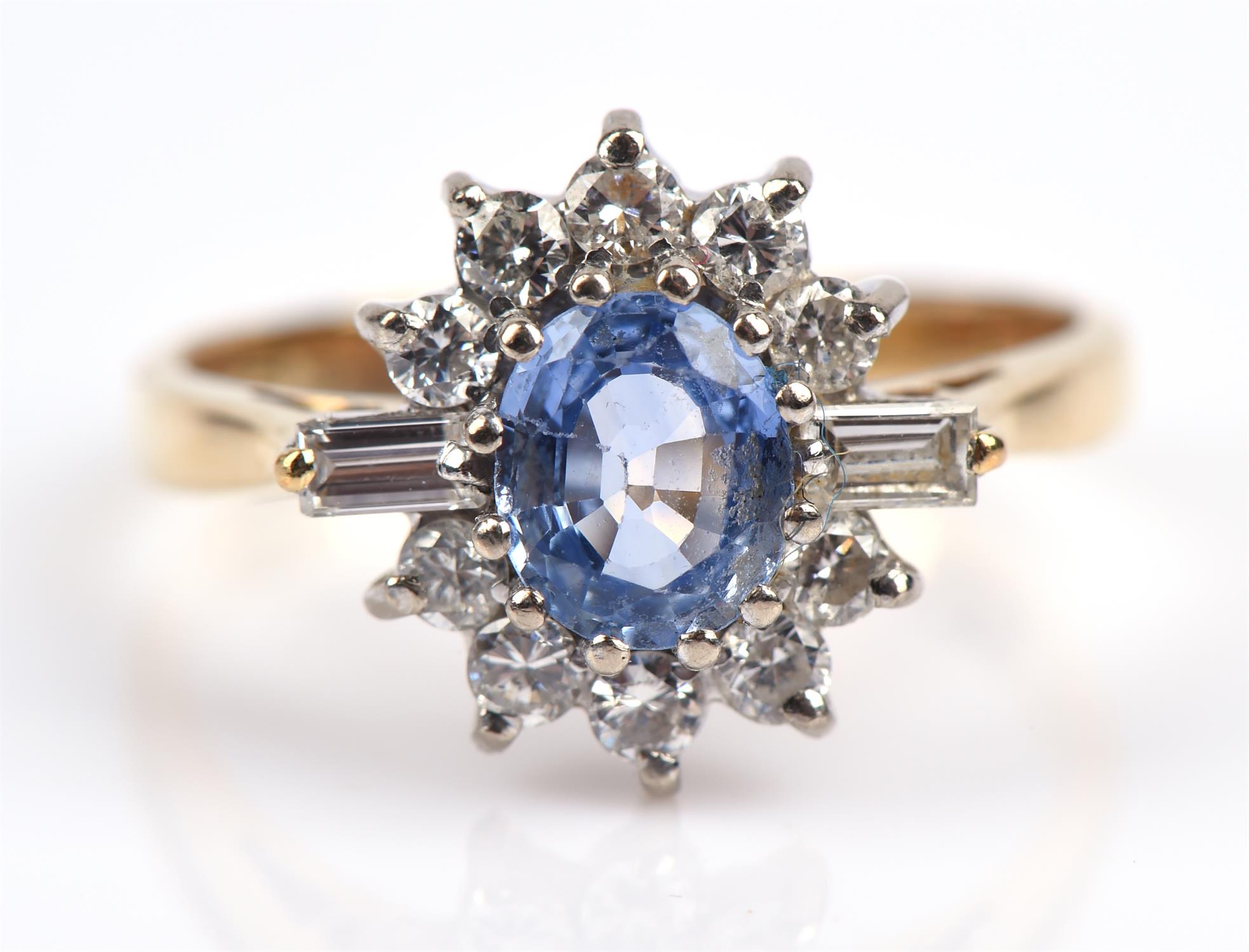 A sapphire and diamond cluster ring, central oval cut sapphire weighing an estimated 0.70 carats, - Image 2 of 7