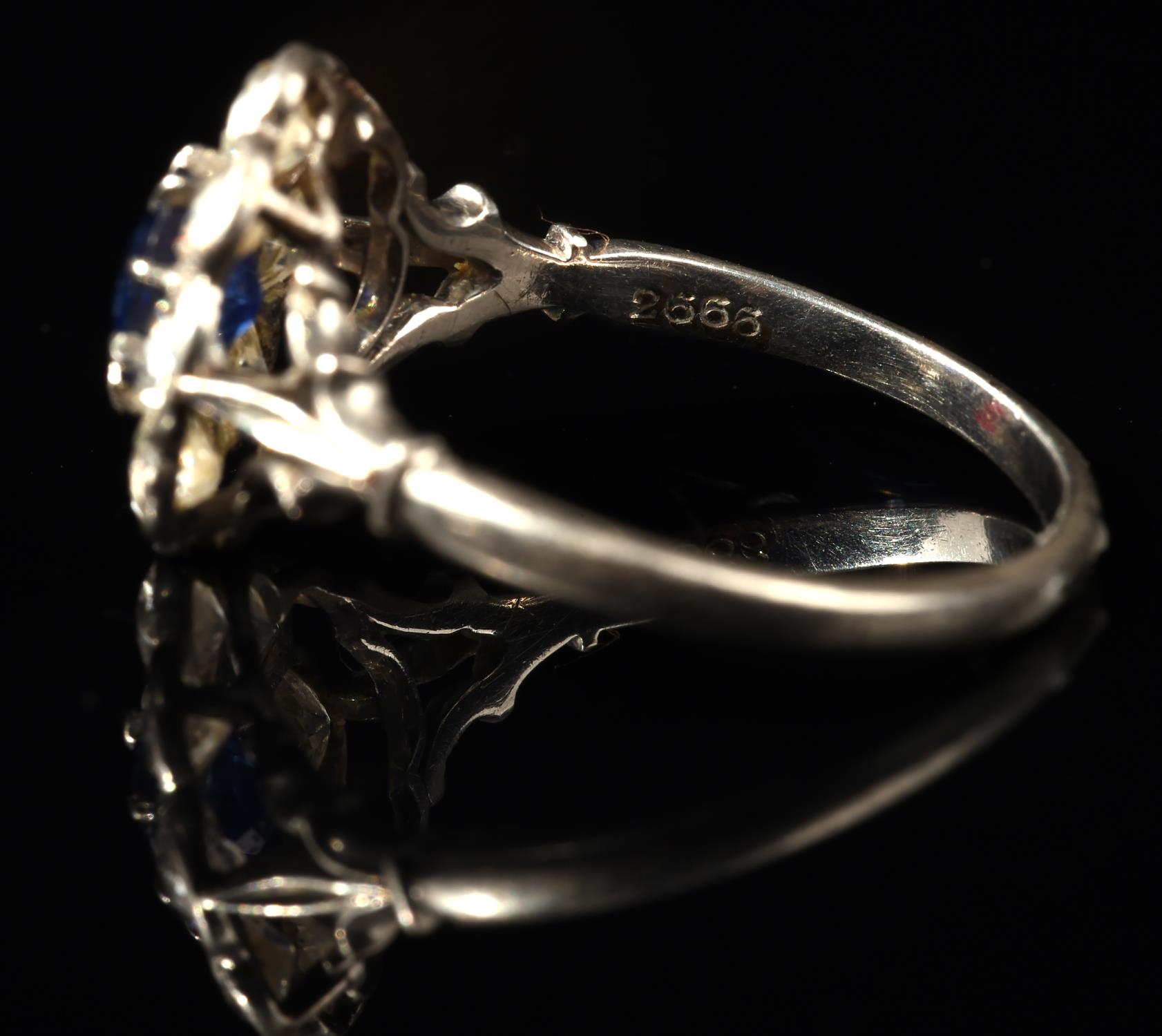 Sapphire and diamond floral cluster ring, with central claw set sapphire weighing an estimated 0. - Image 5 of 5