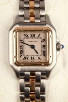 Cartier A ladies reference 1120 Panthere stainless steel wristwatch, the gold bezel,