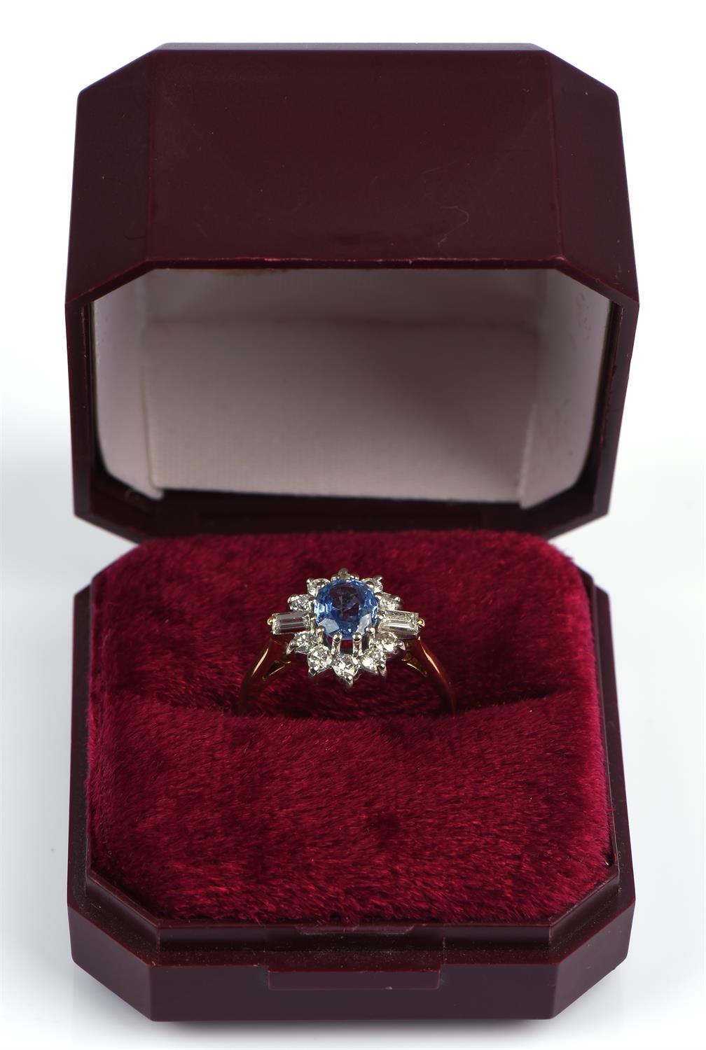 A sapphire and diamond cluster ring, central oval cut sapphire weighing an estimated 0.70 carats, - Image 7 of 7