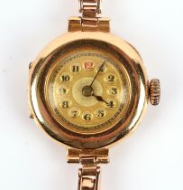 A 1920's Ladies gold wristwatch, the unsigned dial with Arabic numeral hour markers set within a