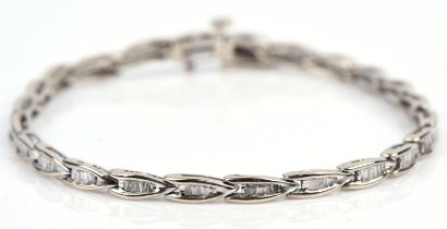 Diamond bracelet consisting of twenty-four sections set with baguette cut diamonds,