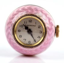 A Garrard pendant watch, spherical charm watch with pink enamel case, with signed Garrard dial,