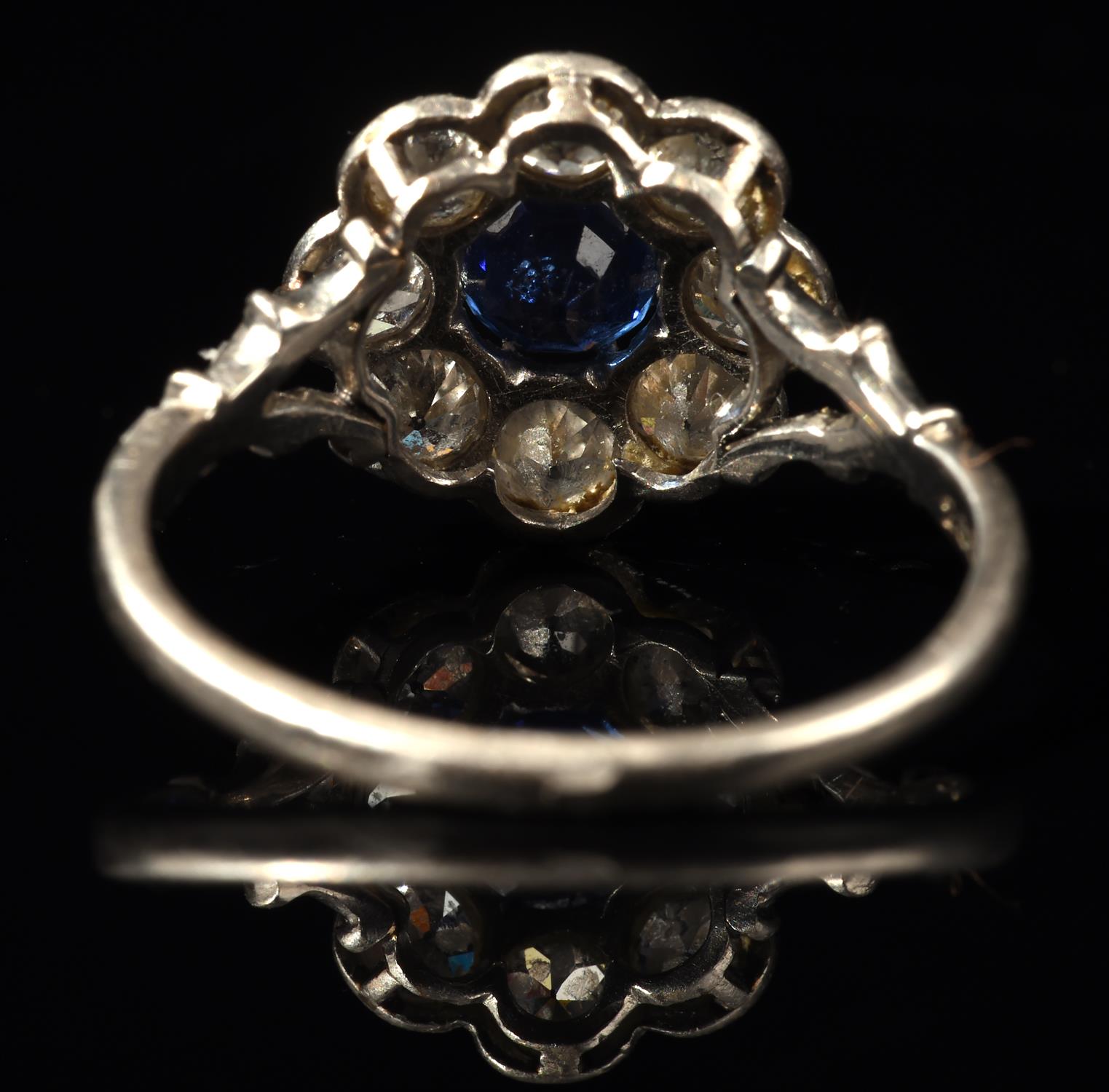 Sapphire and diamond floral cluster ring, with central claw set sapphire weighing an estimated 0. - Image 4 of 5