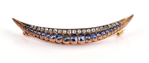 Victorian Sapphire and diamond crescent brooch, set with a row of graduating round cut sapphires,