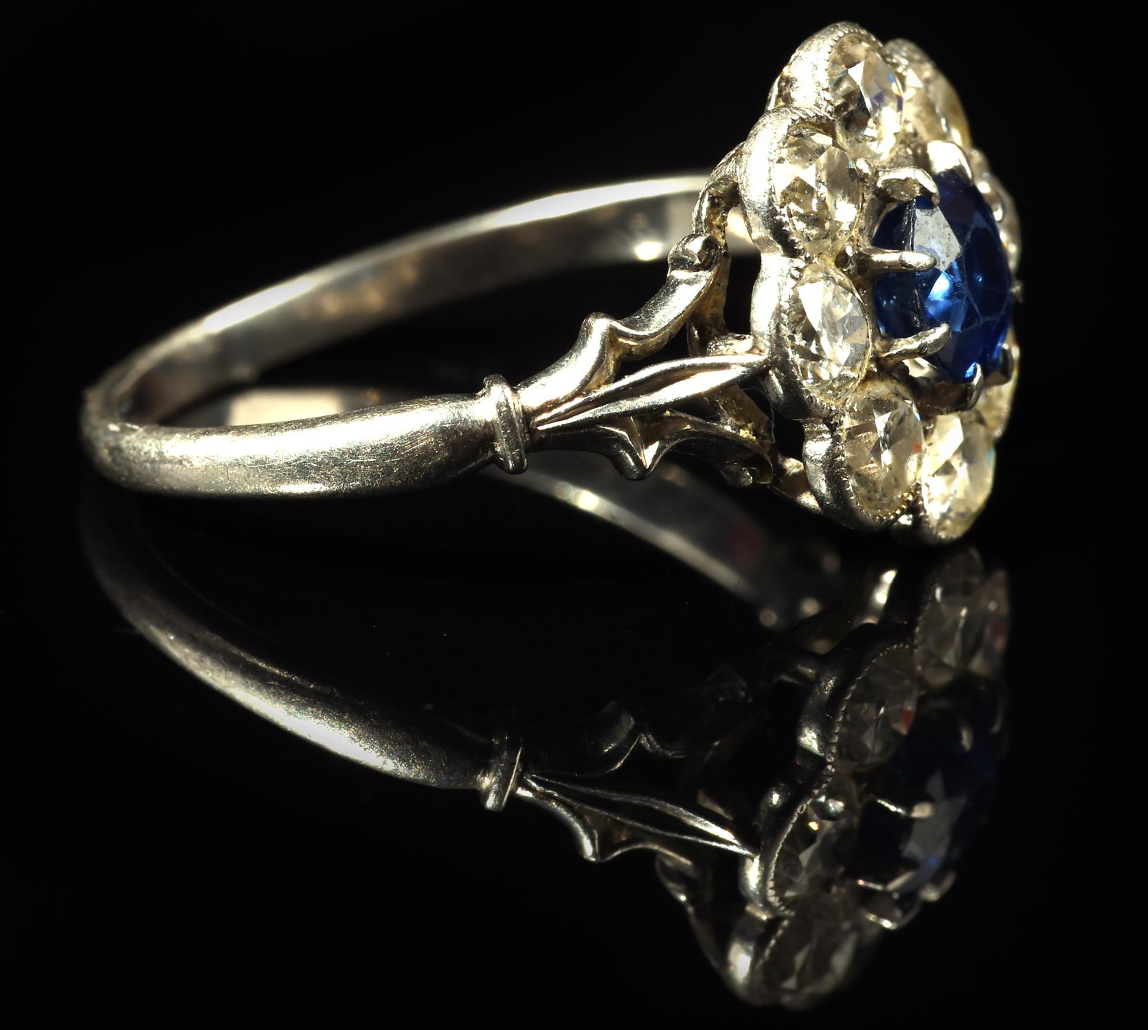 Sapphire and diamond floral cluster ring, with central claw set sapphire weighing an estimated 0. - Image 3 of 5