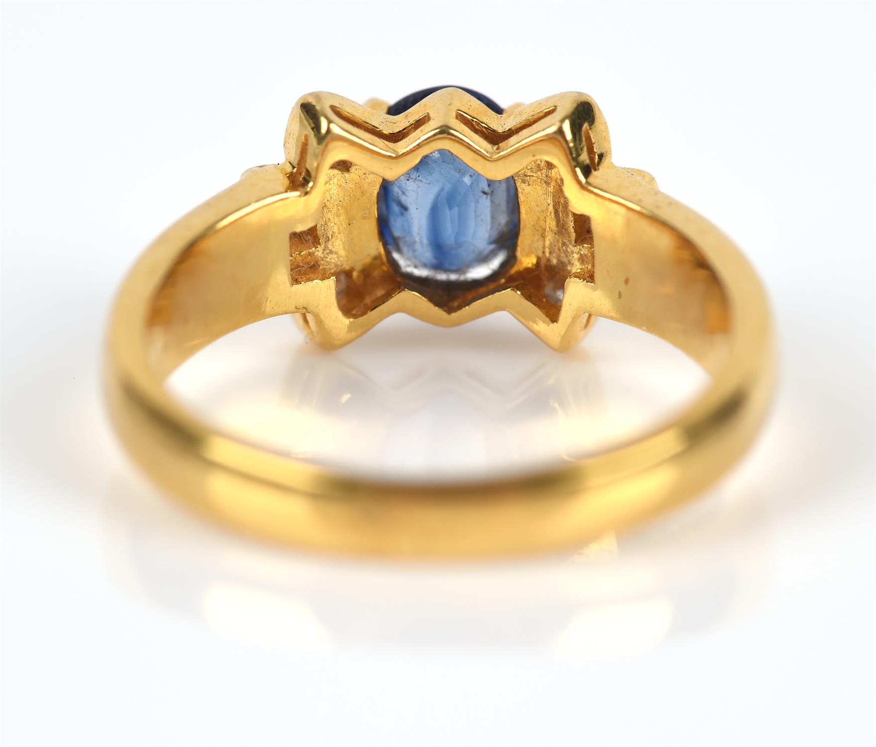 Modern sapphire and diamond ring, central claw set oval cut sapphire weighing an estimated 0. - Image 4 of 5