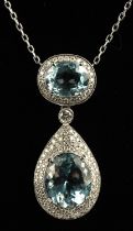 Aquamarine diamond pendant necklace, with oval cut aquamarine weighing an estimated 5.60 carats,