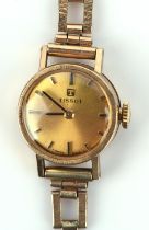 Tissot A Ladies Gold wrist watch, the signed brushed gold dial with baton hour markers,