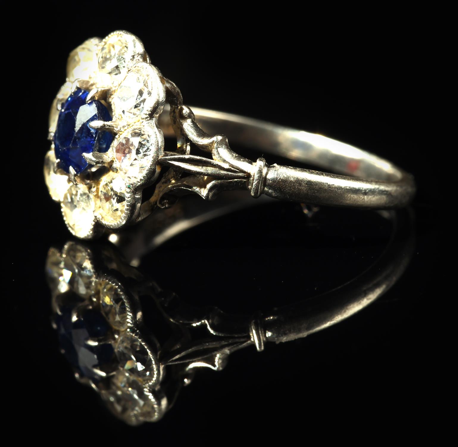Sapphire and diamond floral cluster ring, with central claw set sapphire weighing an estimated 0. - Image 2 of 5