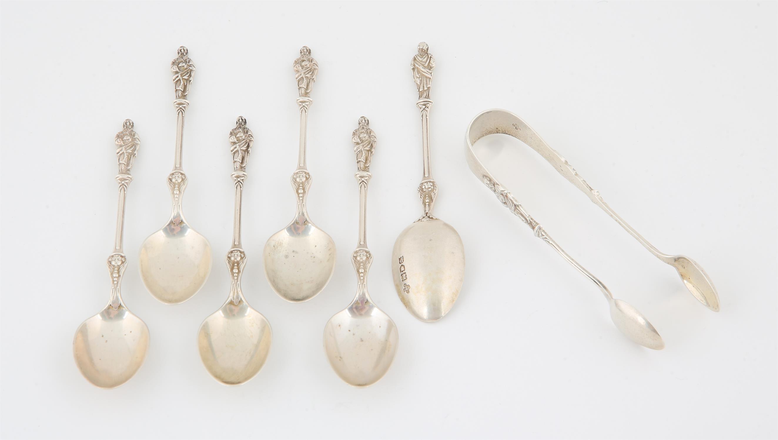 Set of George V silver Apostle finial spoon with tongs with cherubs to lower stem, 114 grams.