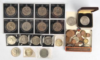 A small coin collection including two (2) Ireland silver ten shillings 1966, about seven (7)