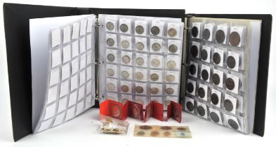 Two albums of coins comprising a collection of British circulated pre-decimal coins,