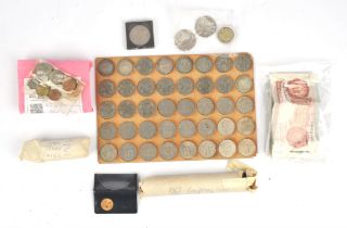 A collection of British coins and bank notes mostly as taken from circulation, including about 230