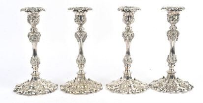 Set of four Elkington and Co, silver pated candlesticks cast with leaves, H26cm