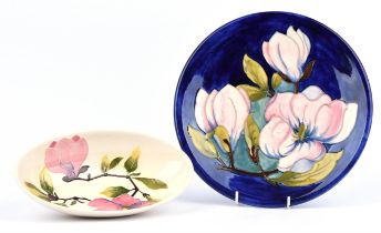 Walter Moorcroft, Magnolia, a plate, on blue ground, impressed and signed marks,