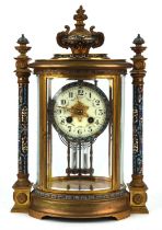 Brass and champleve enamel clock, late19th Century, the case of architectural design with flaming